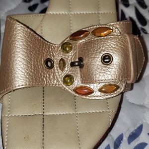 Leather gold clogs.
